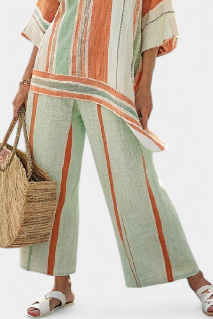 Elegante conjunto de blusa asimétrica a rayas de lino y bambú y pantalones de pierna ancha para un estilo sofisticado.