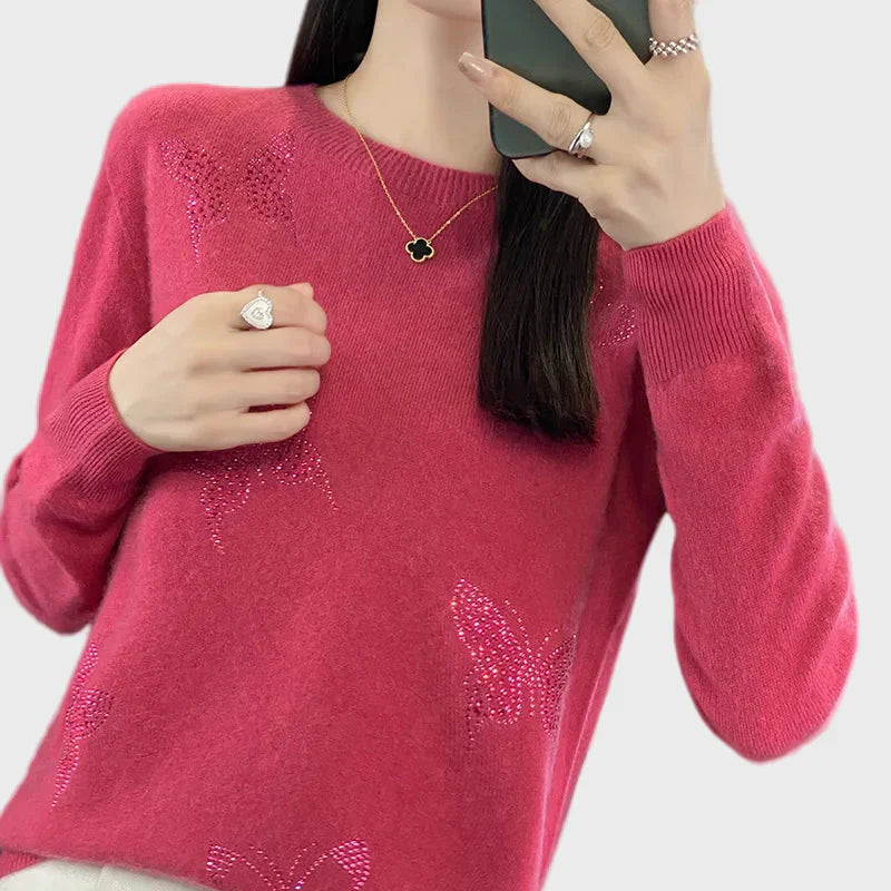 Cuello alto de punto con diseño de mariposa