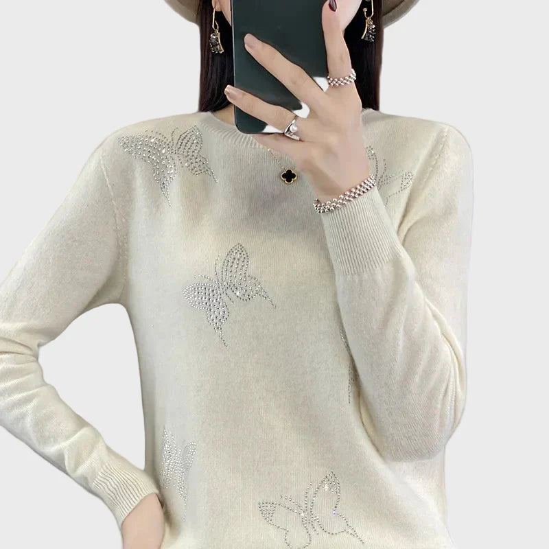 Cuello alto de punto con diseño de mariposa