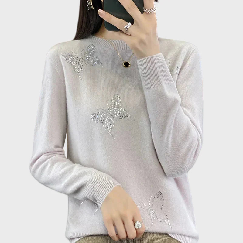 Cuello alto de punto con diseño de mariposa