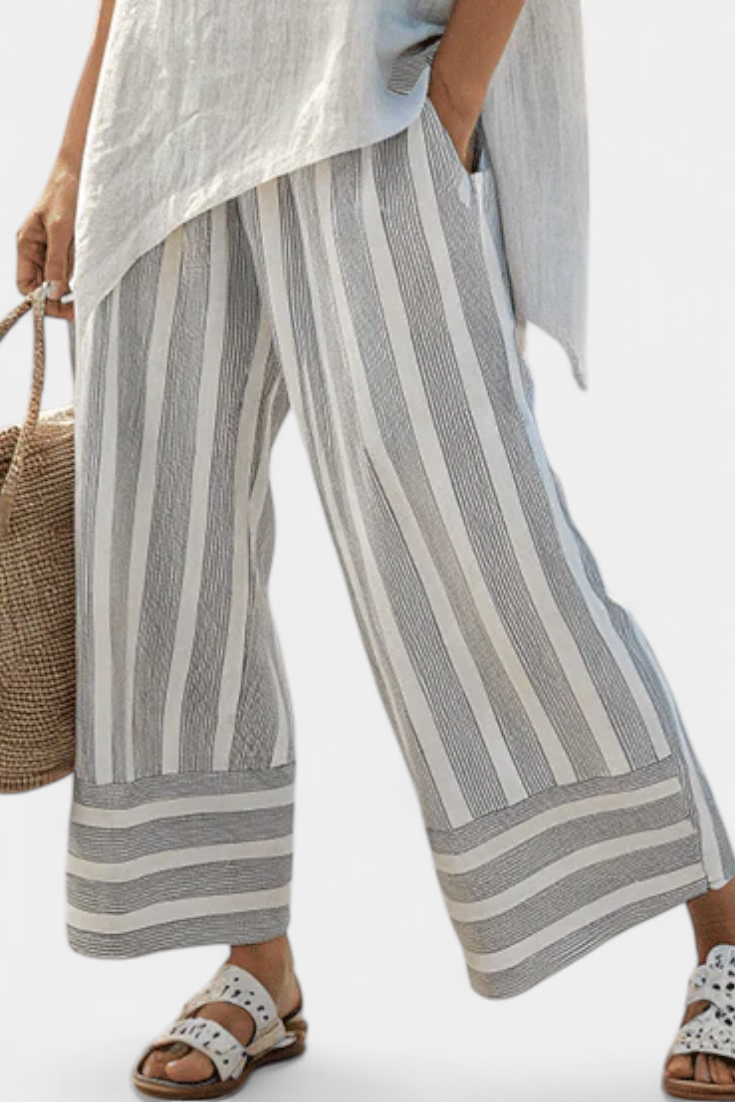 Conjunto Daisy con Blusa Asimétrica y Pantalón de Rayas para un Estilo Moderno y Elegante