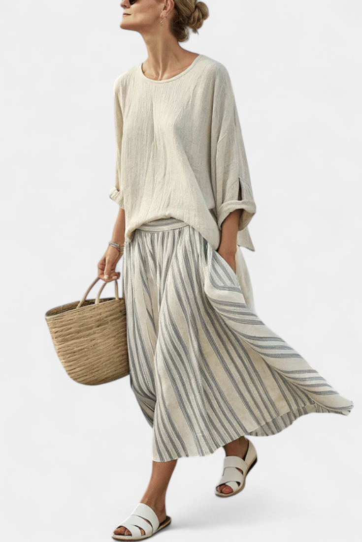Conjunto de blusa oversize informal con margaritas y falda midi a rayas de lino y bambú para un estilo elegante y cómodo.