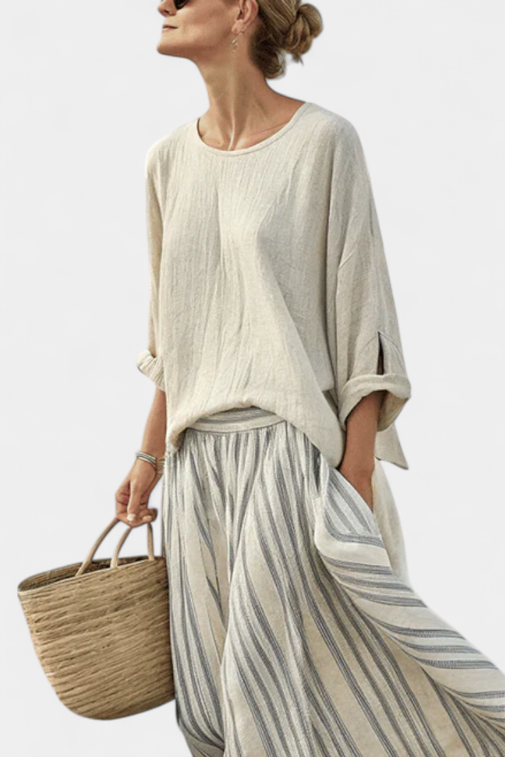 Conjunto de blusa oversize informal con margaritas y falda midi a rayas de lino y bambú para un estilo elegante y cómodo.