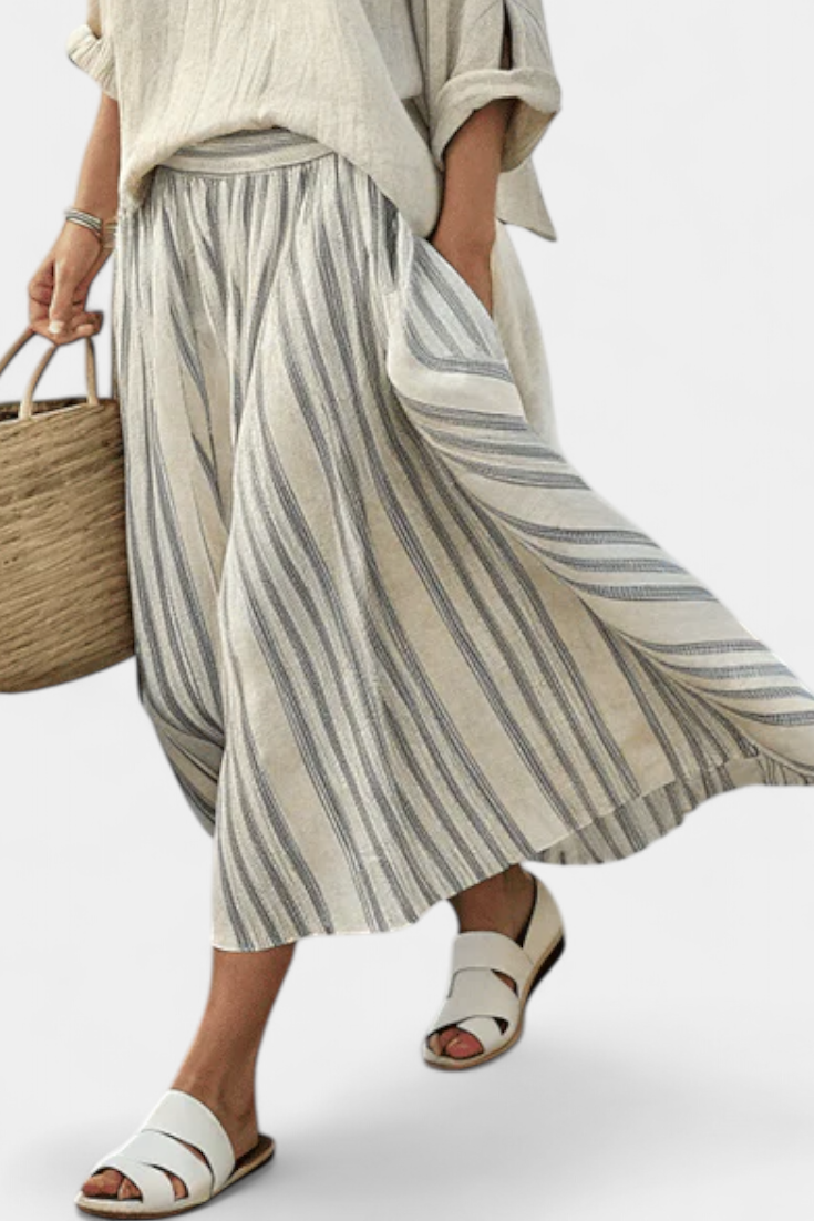 Conjunto de blusa oversize informal con margaritas y falda midi a rayas de lino y bambú para un estilo elegante y cómodo.