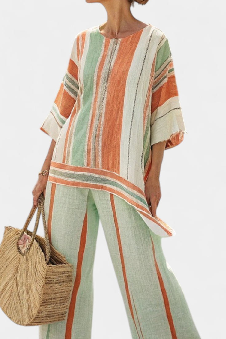 Elegante conjunto de blusa asimétrica a rayas de lino y bambú y pantalones de pierna ancha para un estilo sofisticado.
