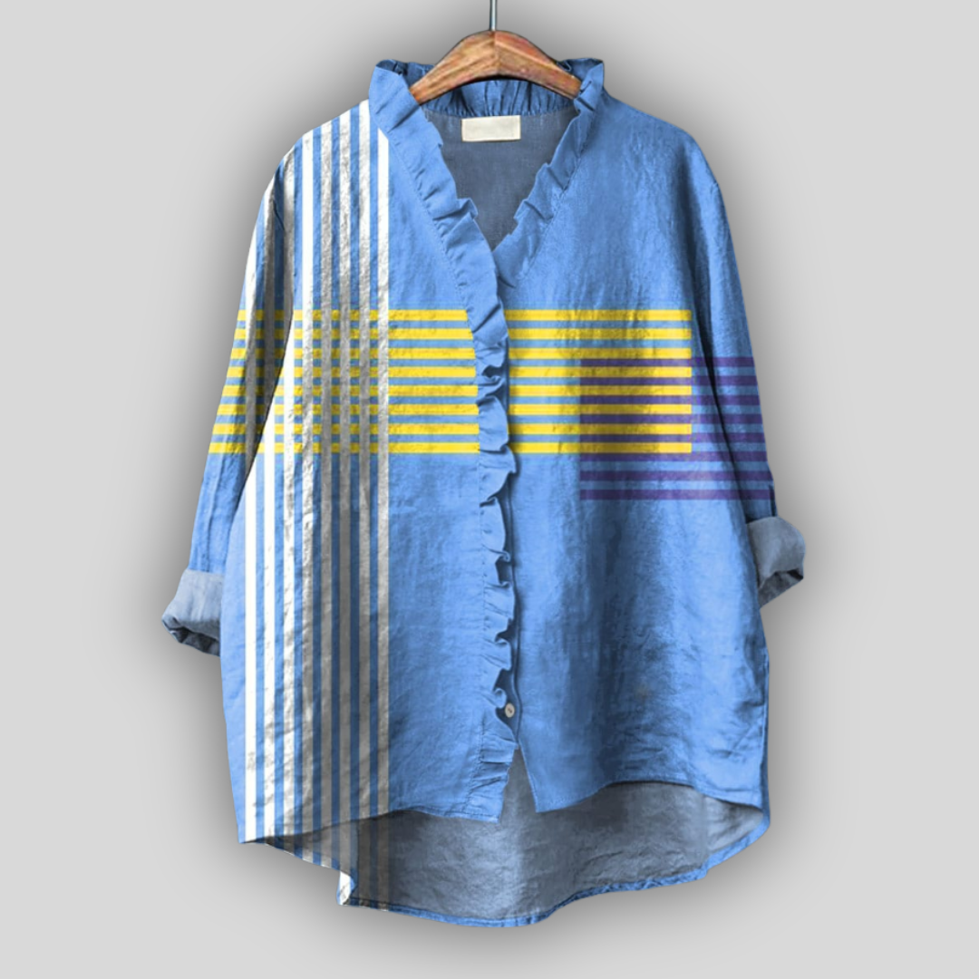 Blusa azul con volantes y detalles de rayas