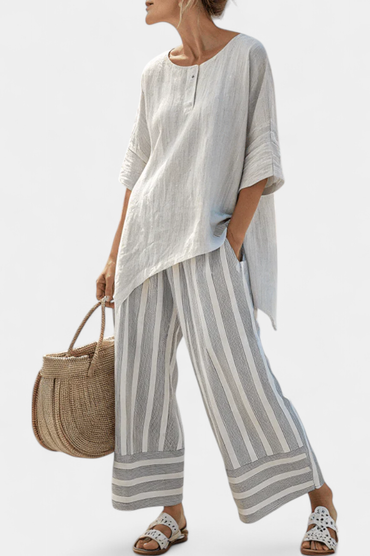 Conjunto Daisy con Blusa Asimétrica y Pantalón de Rayas para un Estilo Moderno y Elegante